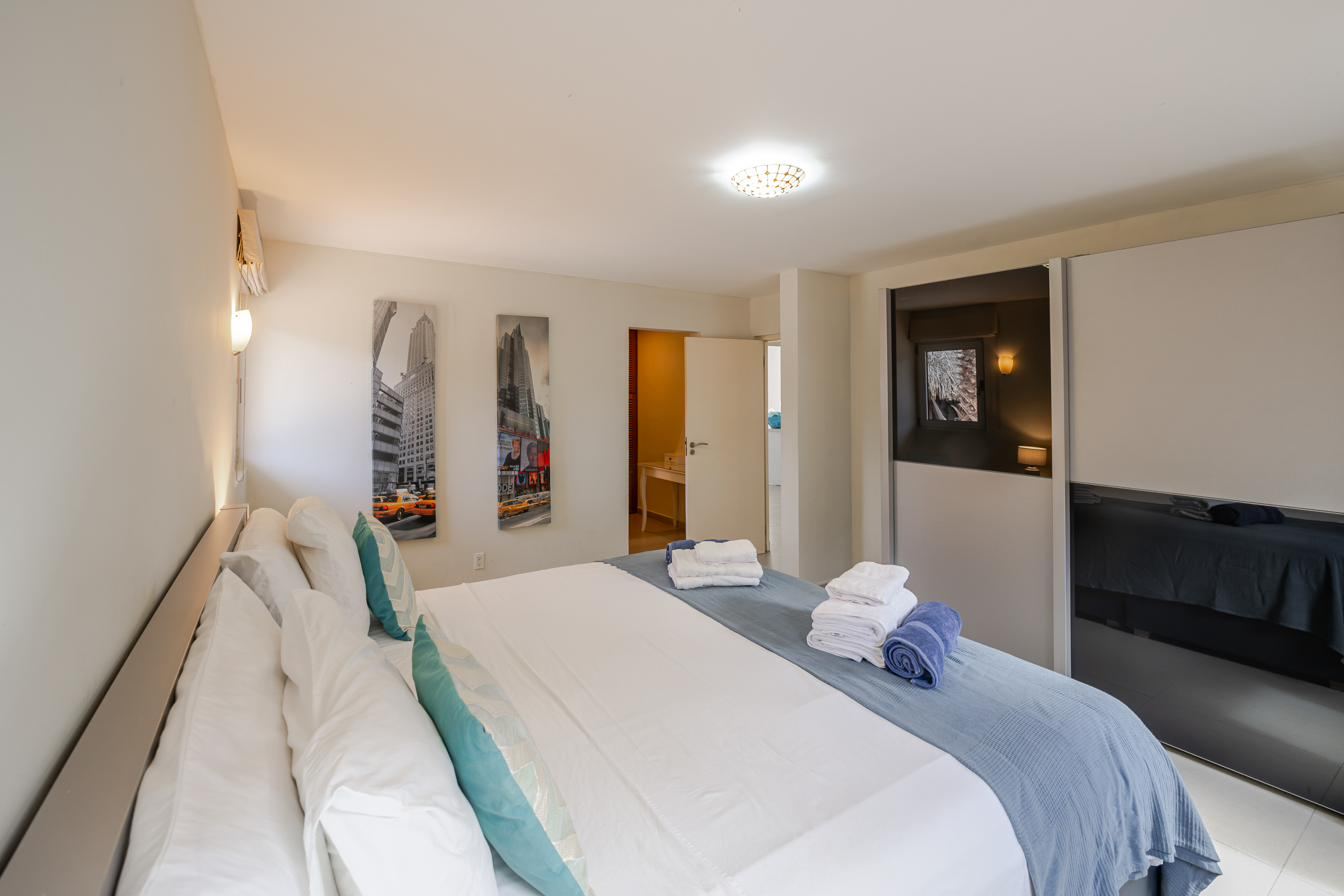Ground-floor master bedroom with double bed and air conditioning